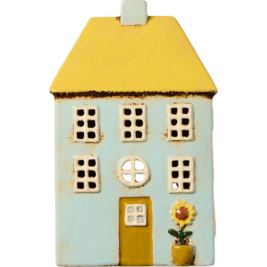 Maisonnette jaune et ses fleurs